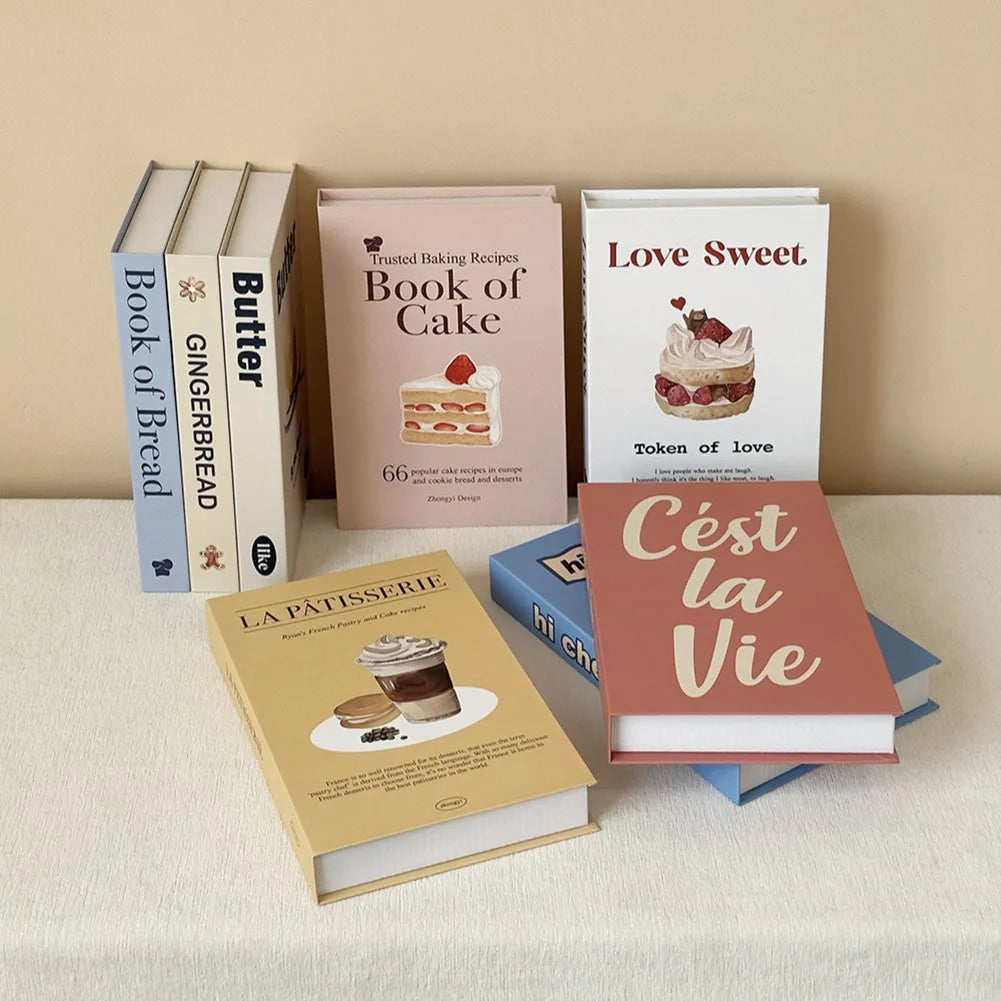 Collection of decorative books on a light surface with a beige background