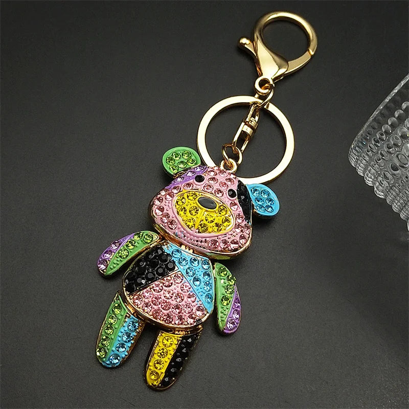 Colorful keychain with a gold ring on a dark background