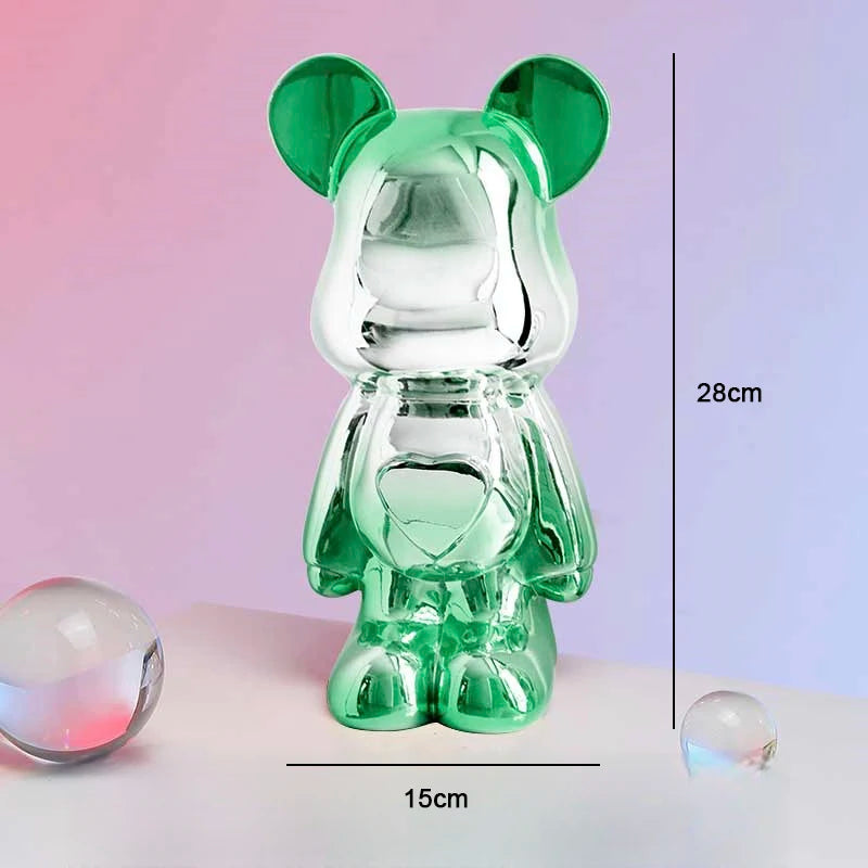 Green glass bear figurine with measurements on a gradient background
