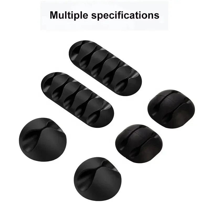Set of black cord organisers on a white background