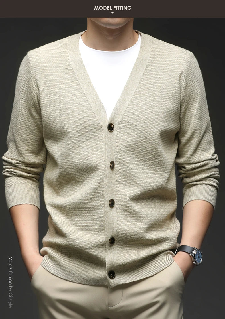 Light green cardigan worn by a person on a dark background