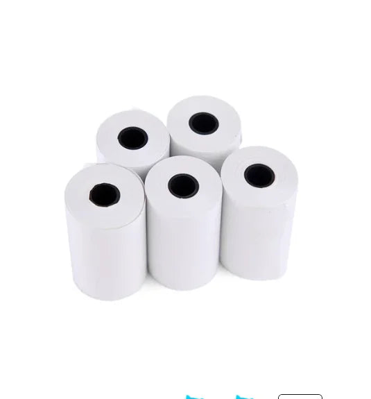 Five white rolls of thermal paper with black centers on a white background
