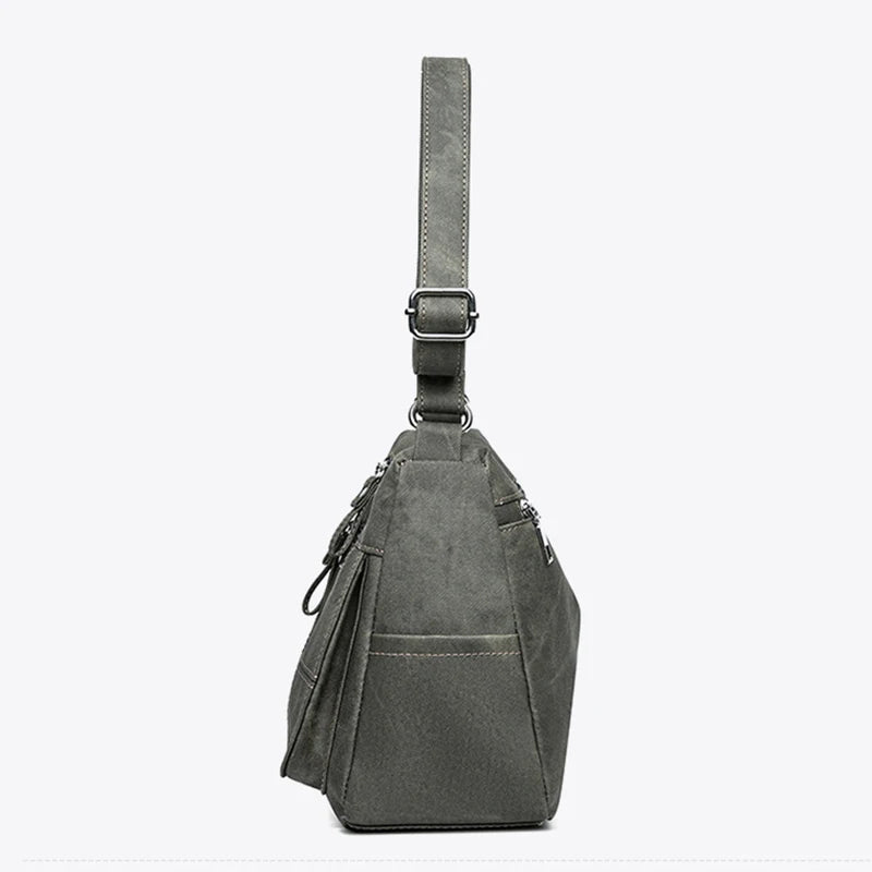 Gray sling bag with a strap on a white background