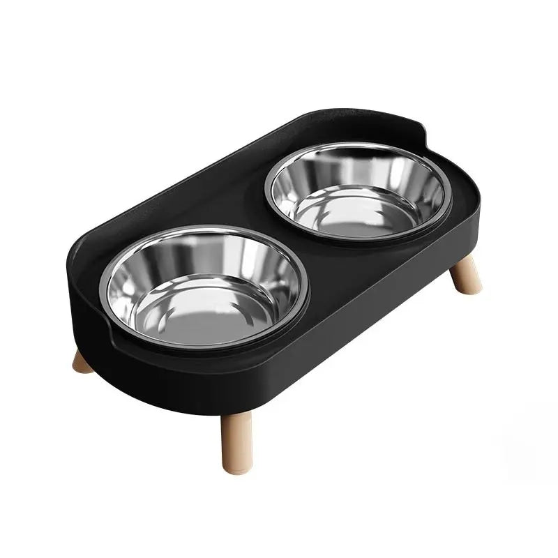 Black elevated pet feeder with two stainless steel bowls on a white background