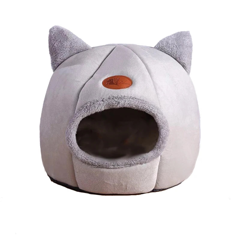 Cat-shaped pet bed with a soft texture on a white background