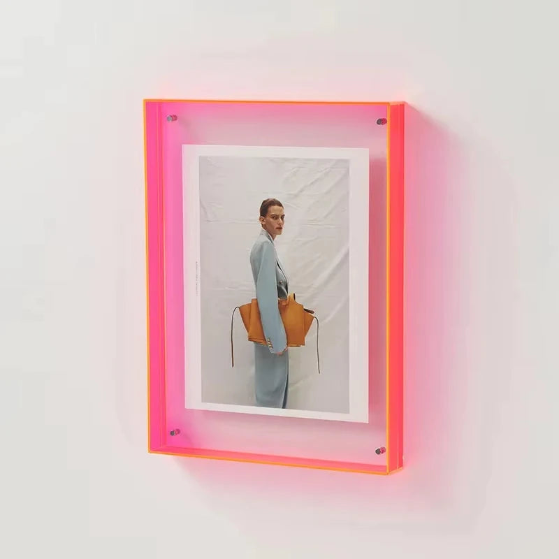 Neon Pink Photo Frame with a photo inisde of a woman holding a bag