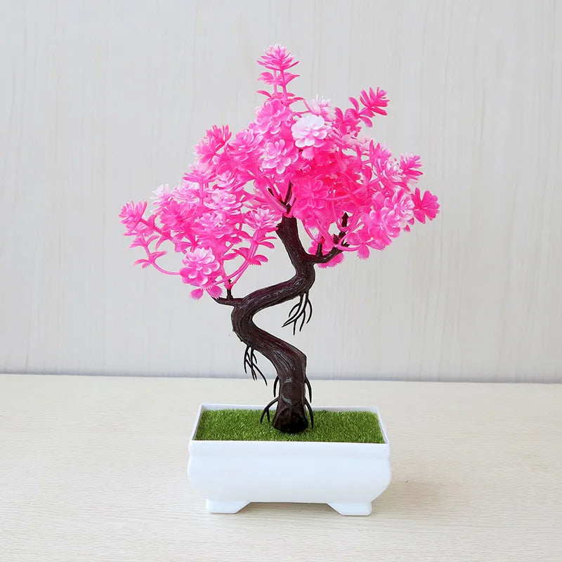 Bonsai tree with pink blossoms in a white pot on a light background