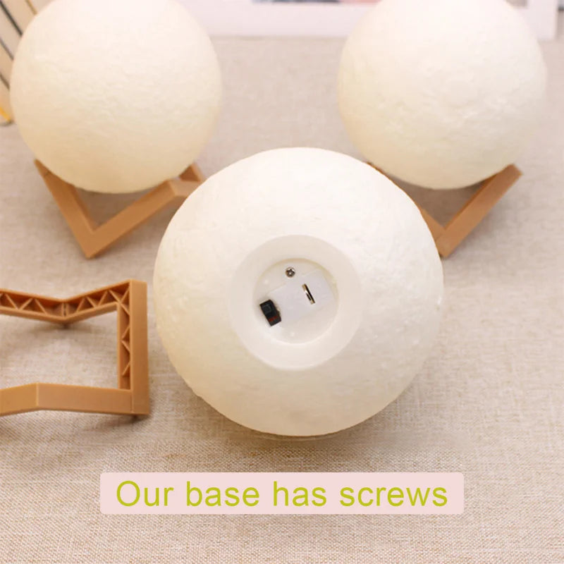 White spherical lamp with visible screws on a beige fabric background