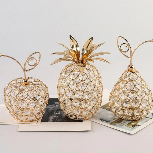 Gold crystal fruit ornaments including apple, pineapple and pear design on table, decorative luxury home decor pieces with rhinestone detailing