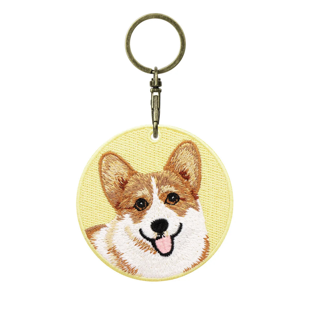 Keychain with embroidered dog design on a white background