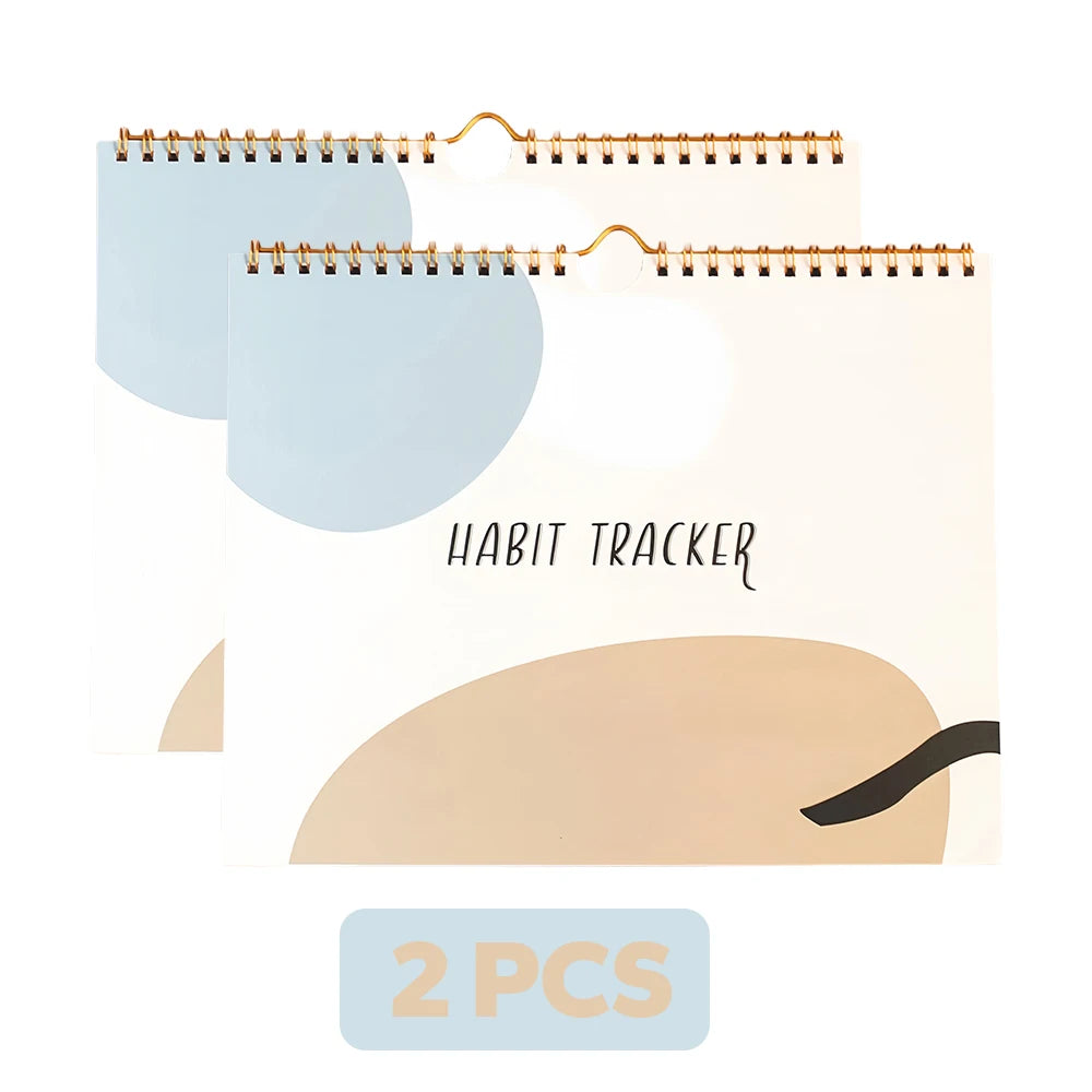 Habit tracker with two spiral-bound notebooks in light blue and beige on a white background.