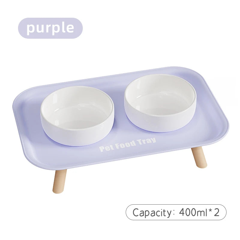 Purple pet food tray with two white bowls on a white background