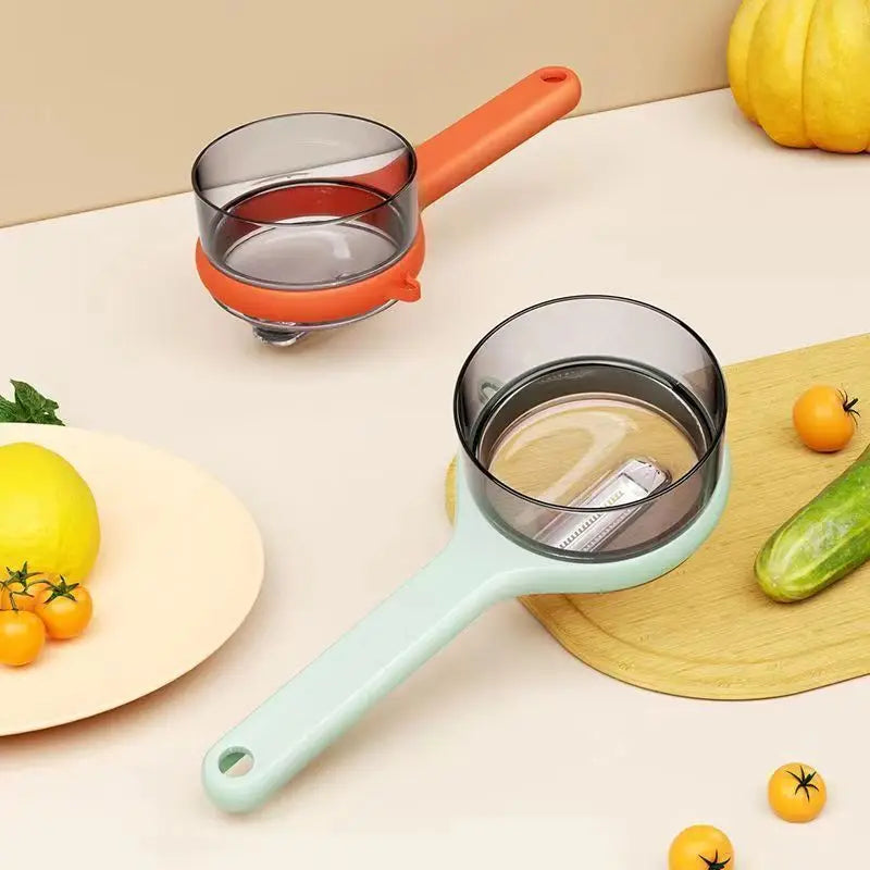 Two kitchen food peelers with colorful handles on a table with vegetables.