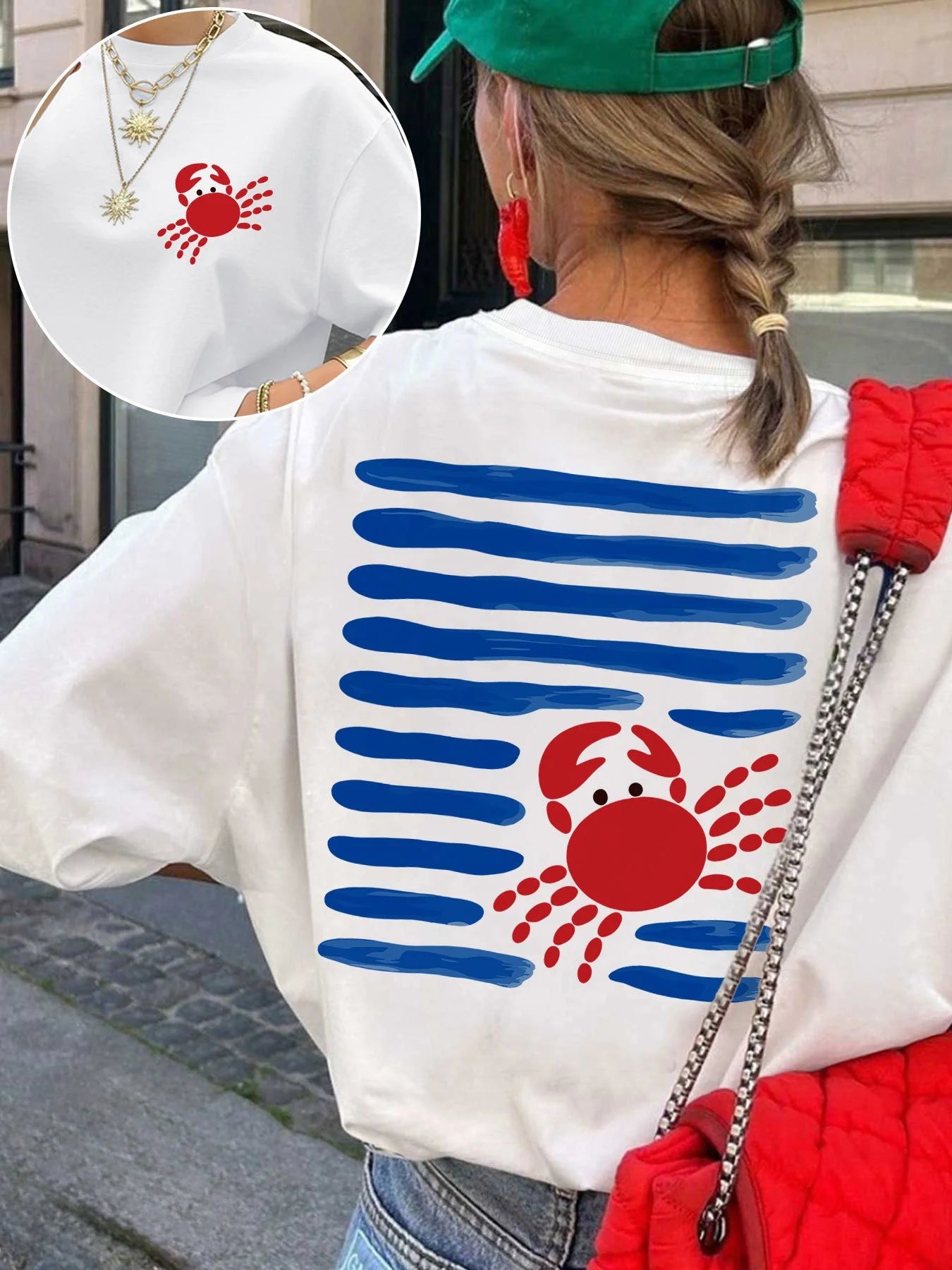Women’s white short sleeve t-shirt with blue stripe and red crab print design on the back