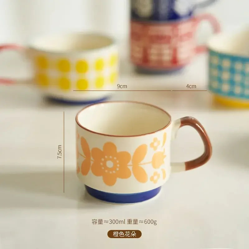 Ceramic mug with floral design and measurements on a neutral background