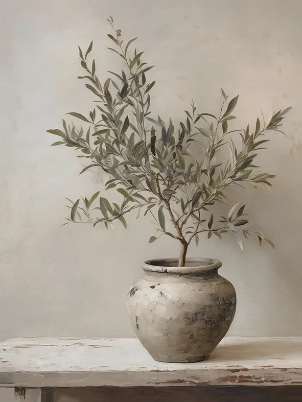 Potted plant on a wooden table with a neutral background