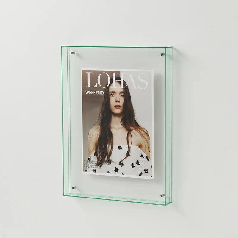 Clear Acrylic Photo Frame displaying a magazine with a woman on the cover against a white background