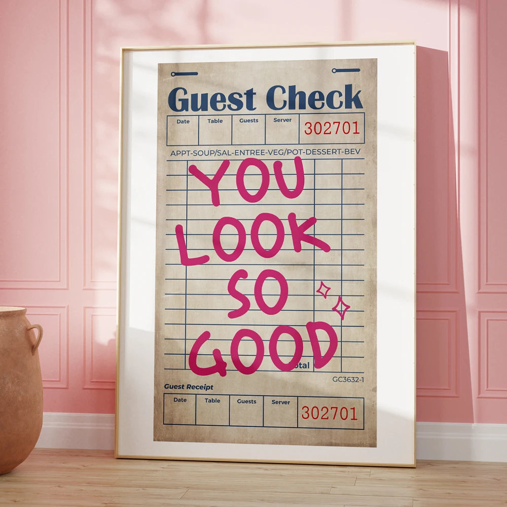 Framed print of a vintage restaurant check with 'You Look So Good' text on a pink wall.