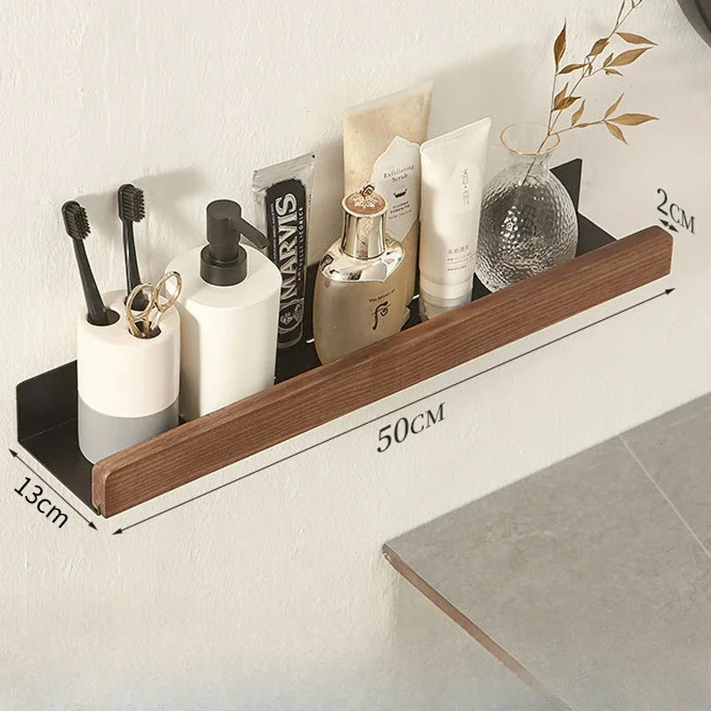 Bathroom shelf with various toiletries and measurements on a white wall.