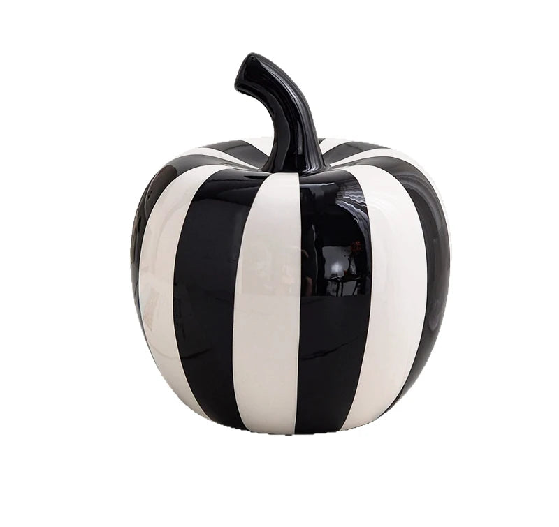 Black and white striped apple-shaped container on a white background