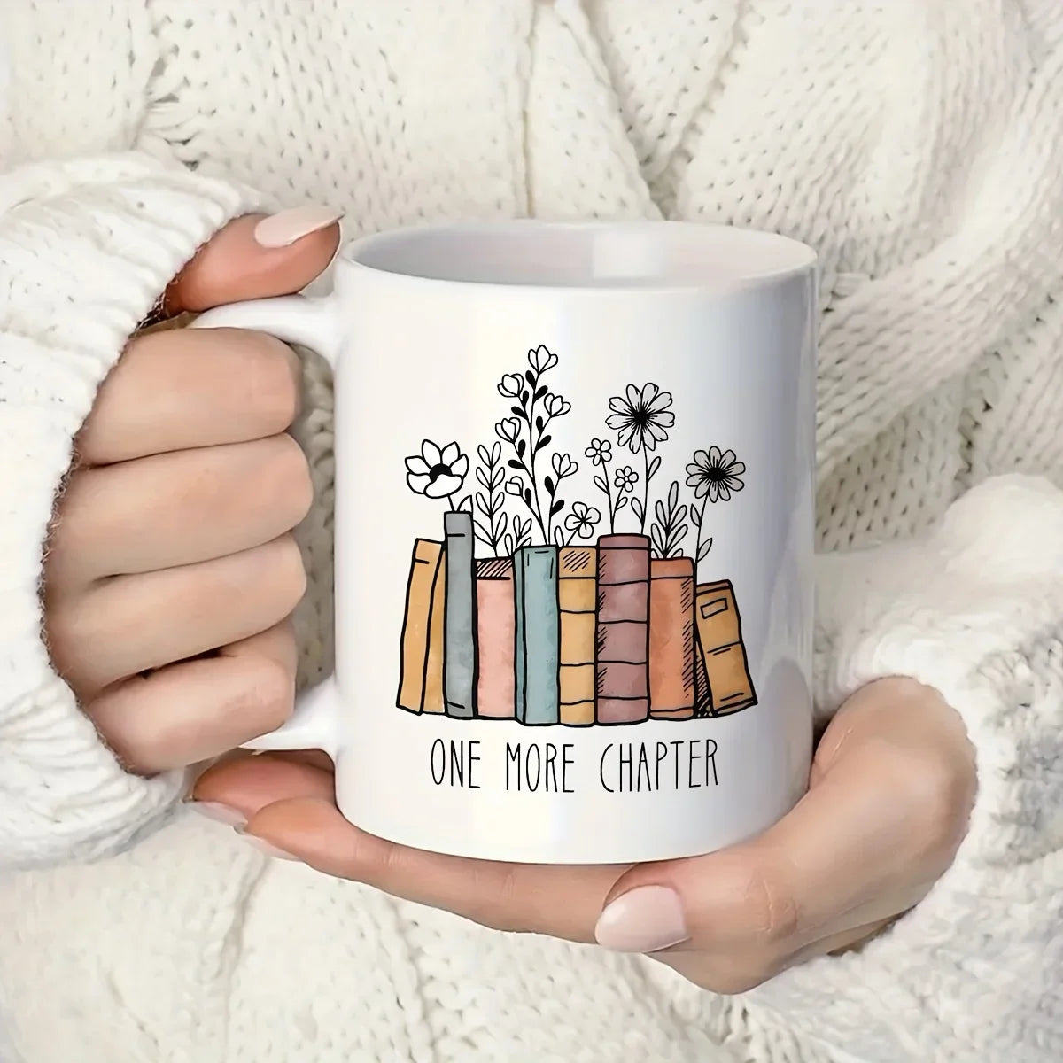 Floral ceramic mug featuring the phrase "Another Chapter" alongside an illustrated book design. A charming 320ml coffee cup for book lovers, readers and cosy reading nook decor