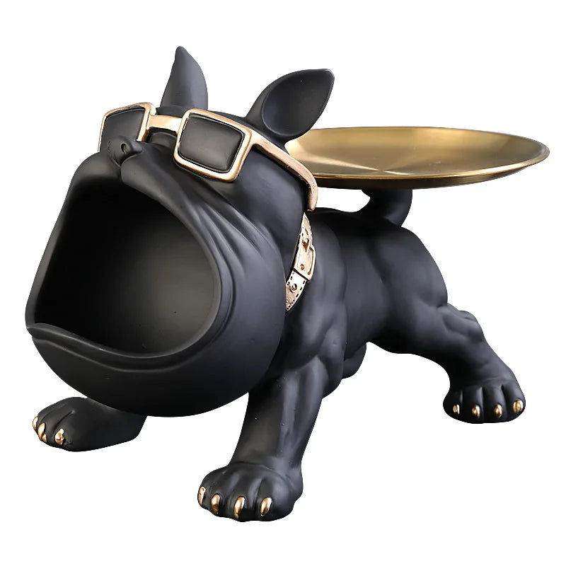Black dog-shaped object with a gold tray on a white background