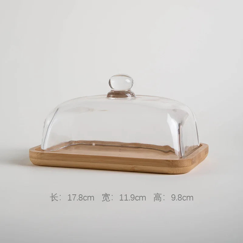 Glass pastry display dome with bamboo serving base
