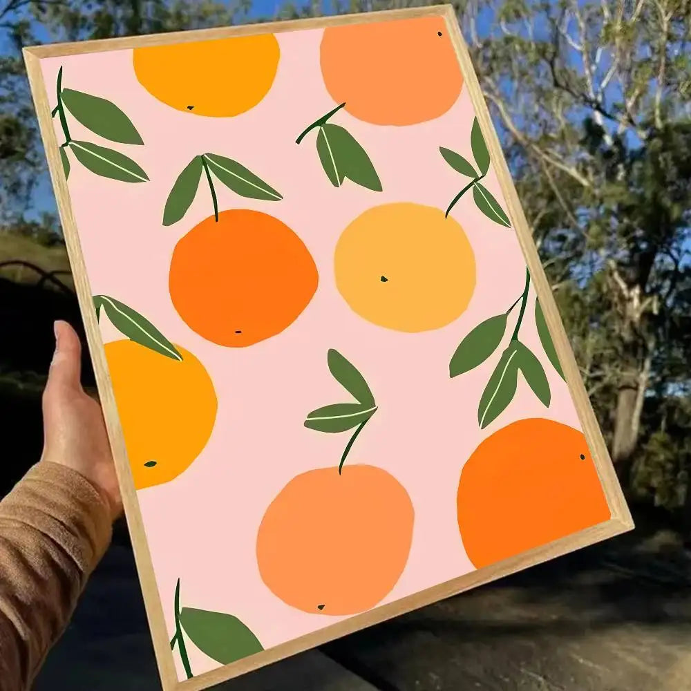 Framed artwork with orange and green pattern held outdoors