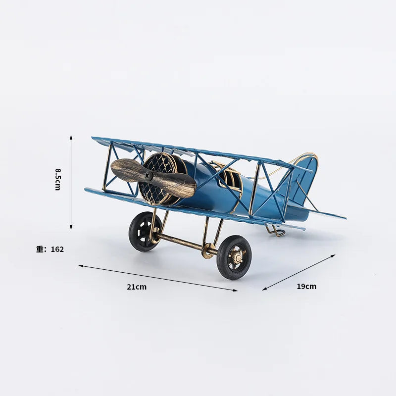 Vintage metal airplane ornament with a detailed retro aircraft design, available in red, yellow and blue for desk or shelf display.