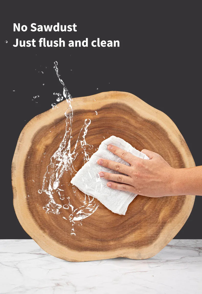 Person cleaning a wooden surface with a white cloth, water splashing onto it.