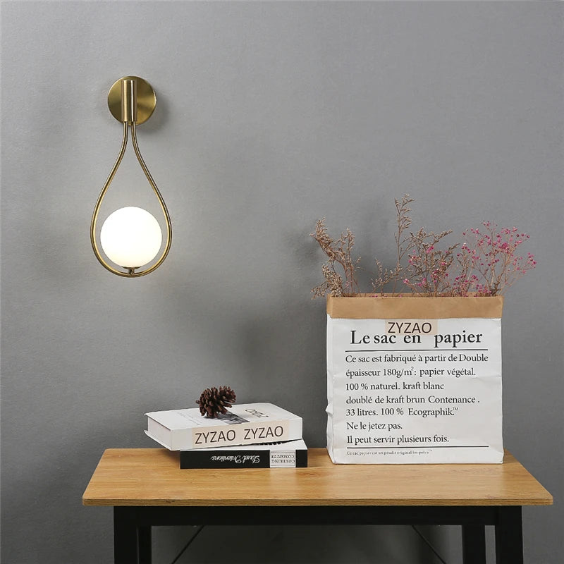 Wall-mounted light fixture on a wooden table with ZYDAO branding against a gray wall.