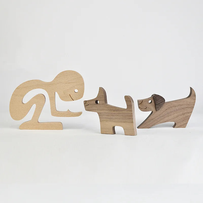 Three wooden animal figures on a white background