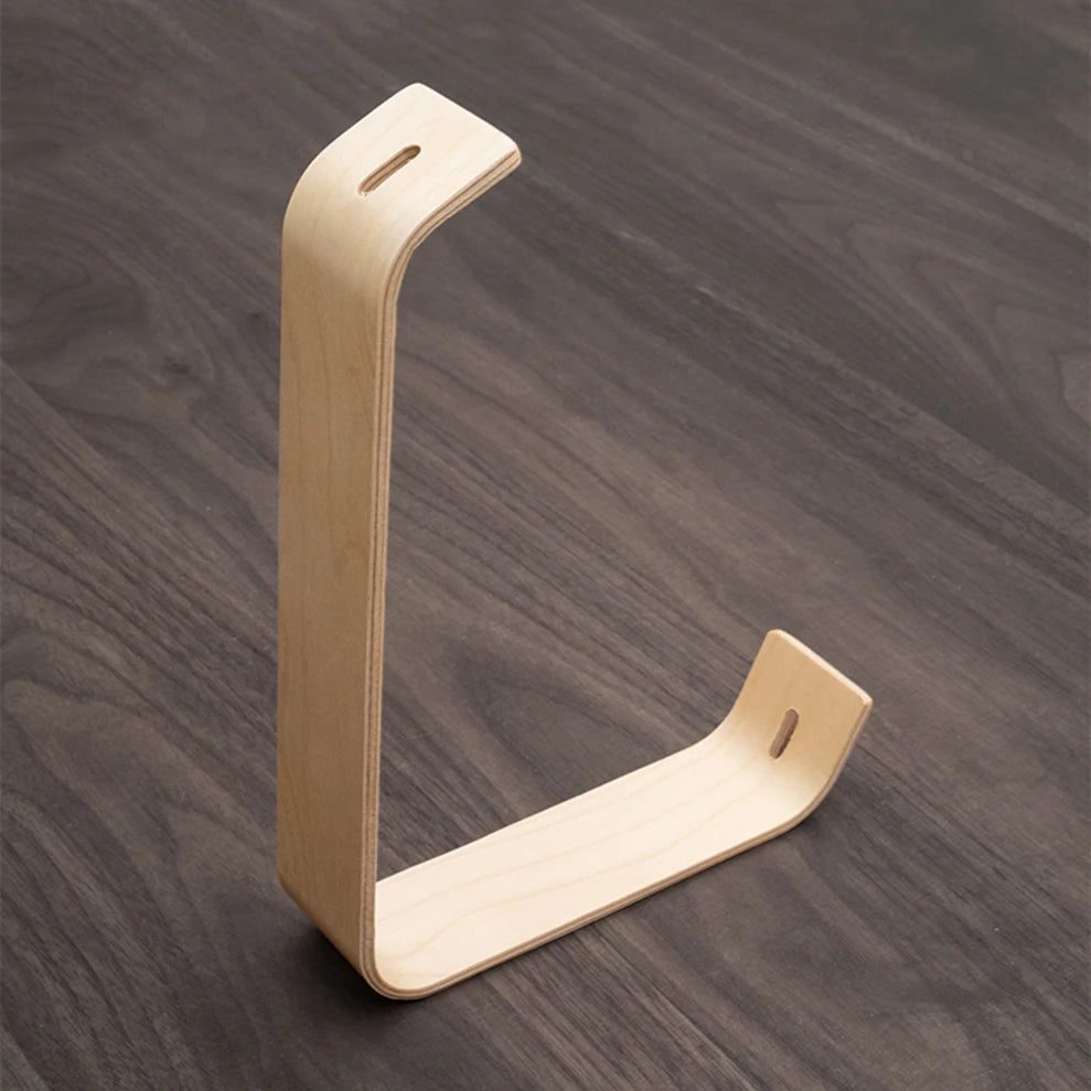 Wooden L-shaped photo frame on a wooden surface