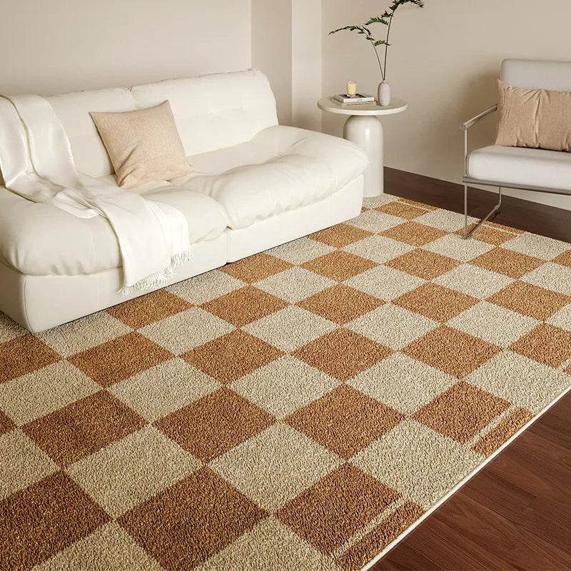 Living room with a checkered brown and beige rug, white sofa, and side table.