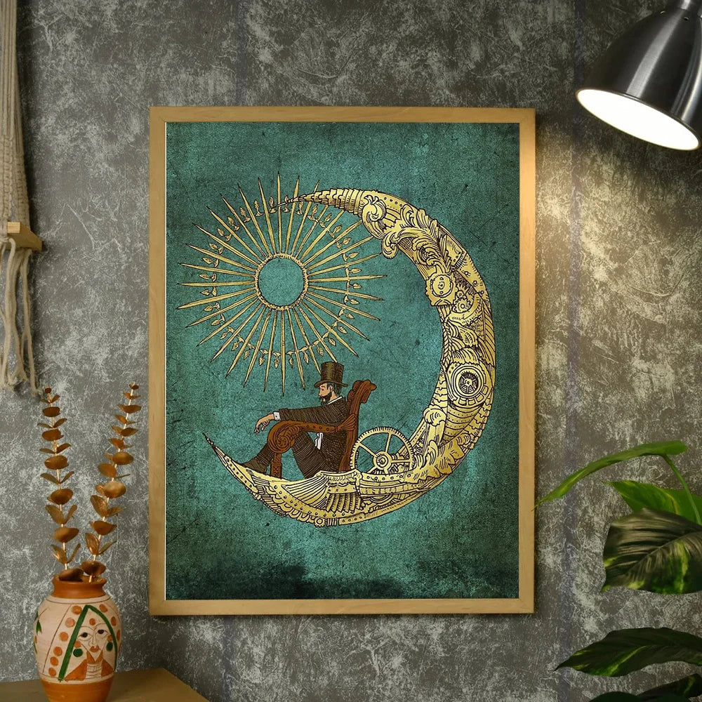 Decorative wall art with a gold crescent moon design on a teal background, framed in gold, against a textured gray wall.