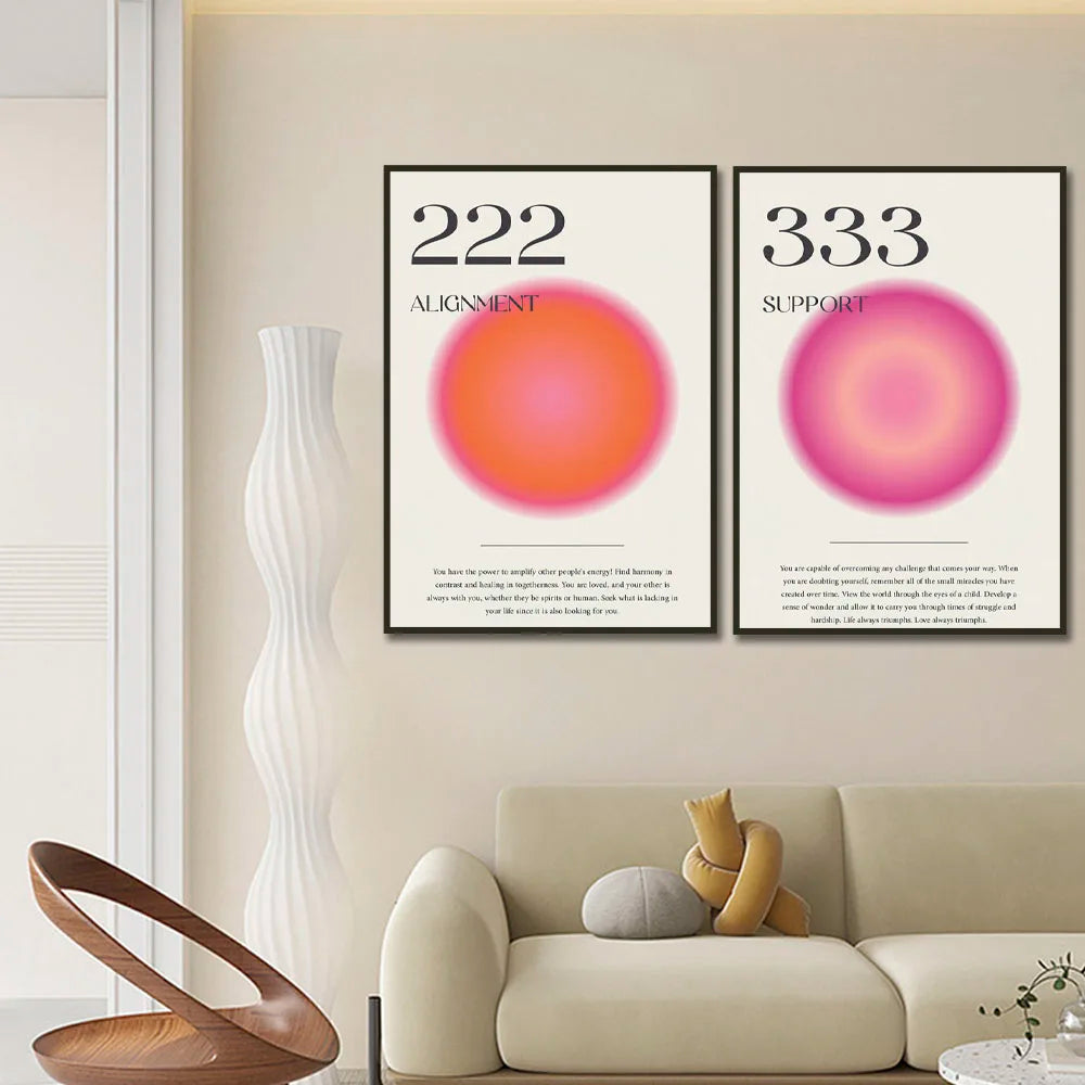 Two framed posters with numbers and abstract designs on a wall above a sofa.