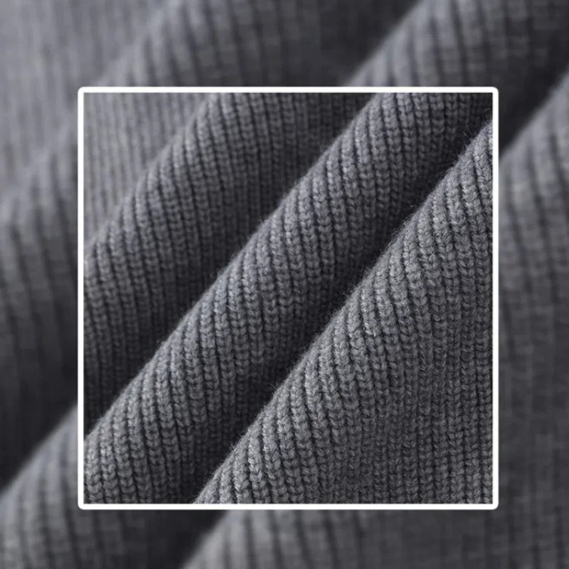 Close-up of textured gray fabric with a focus on the pattern and texture.