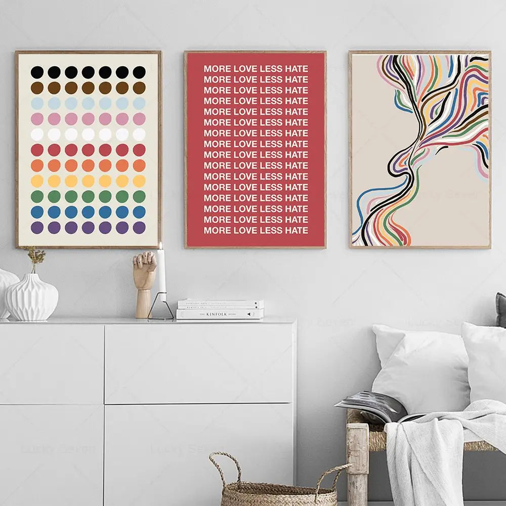 Three framed artworks on a wall with a minimalistic interior design.
