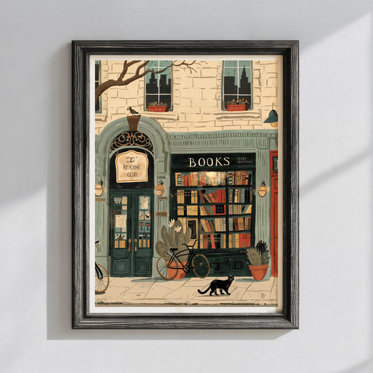 Framed artwork of a bookshop with a cat and bicycle on a white wall