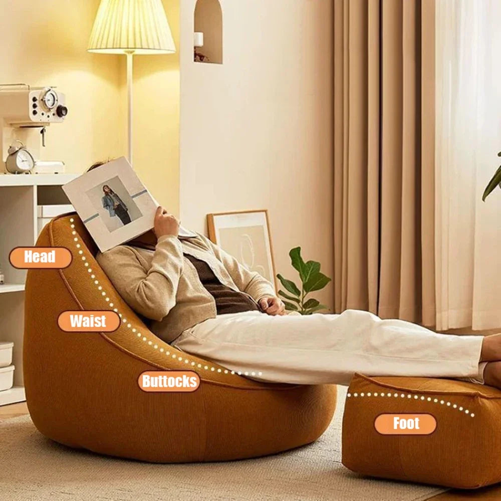 Person relaxing on a bean bag chair in a cozy living room.