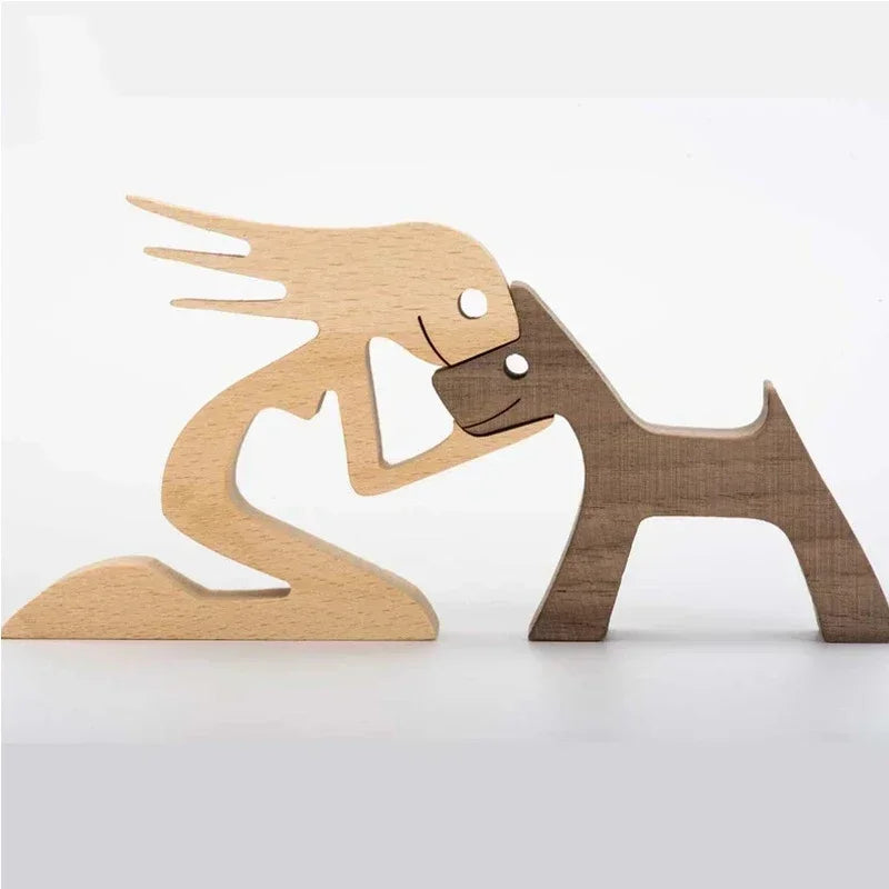 Wooden sculpture of a person and a dog on a white background