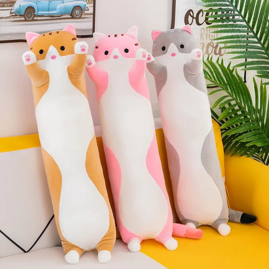 A collection of long cat plush pillows in light brown, grey and pink, available in multiple sizes with raised paws and a kawaii-inspired design.
