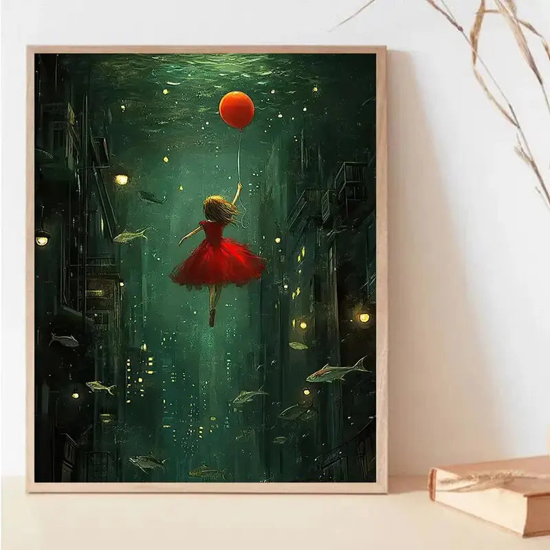 Framed artwork of a girl in a red dress floating underwater with a fish and a red ball.
