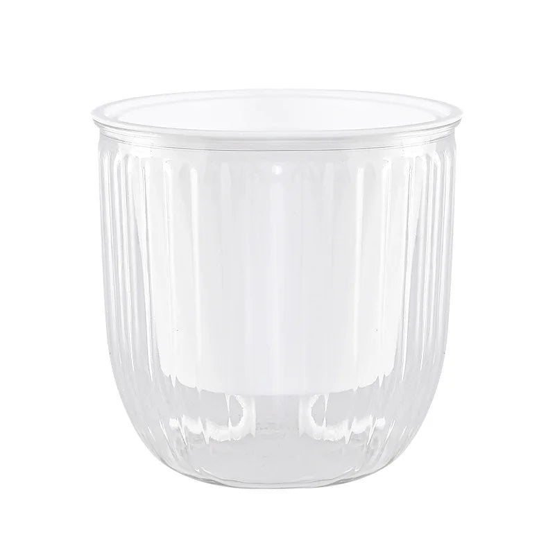 Close up view of a Transparent hanging plant pot with metal chain and ribbed design for indoor plants.