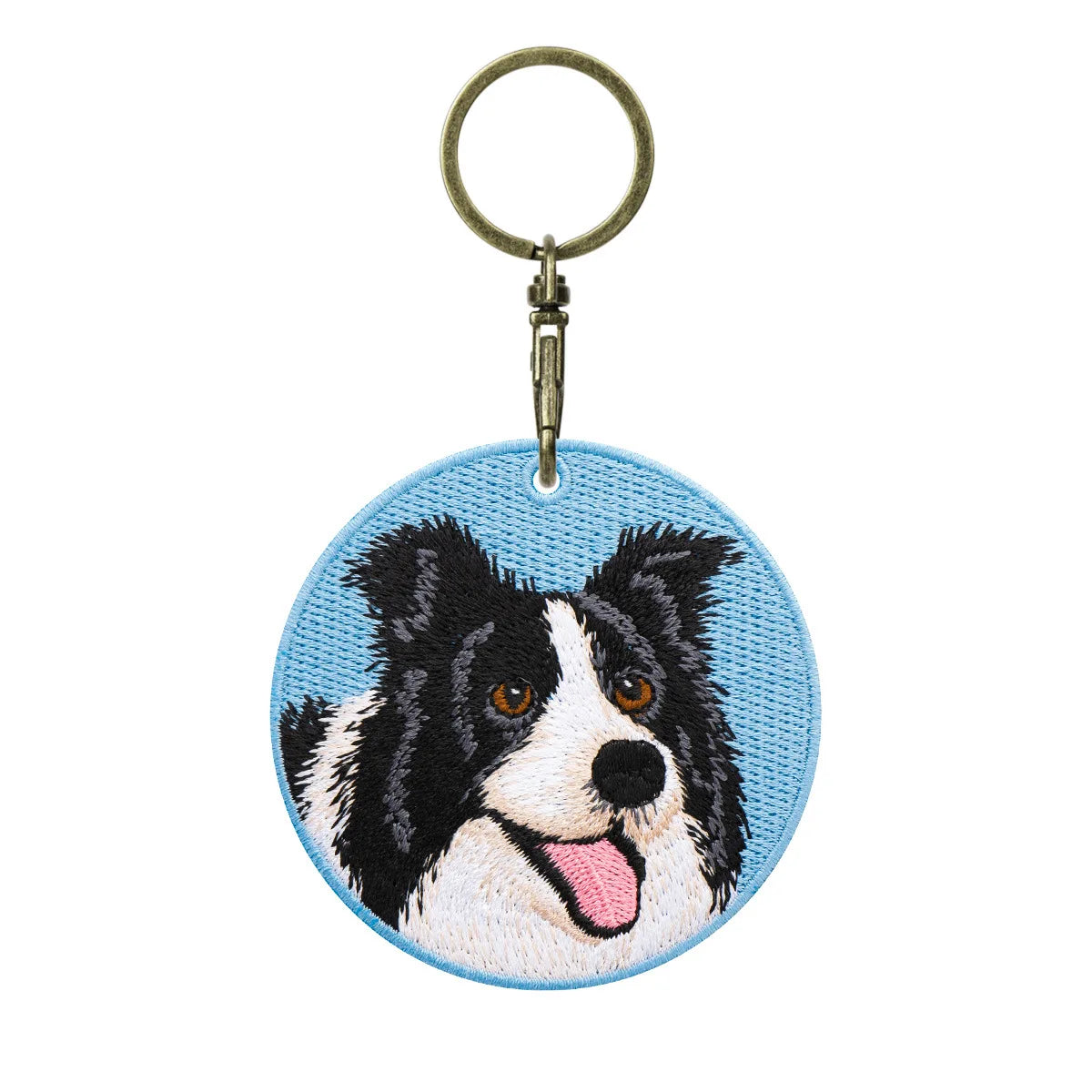 Keychain with embroidered dog design on a blue background