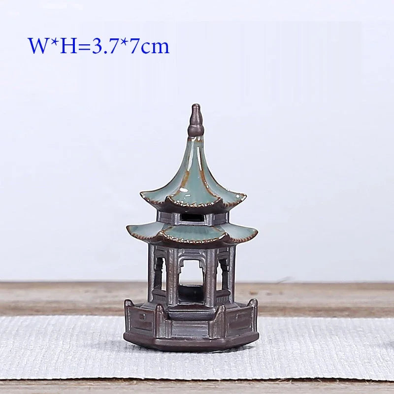 Small pagoda model on a white surface with dimensions displayed