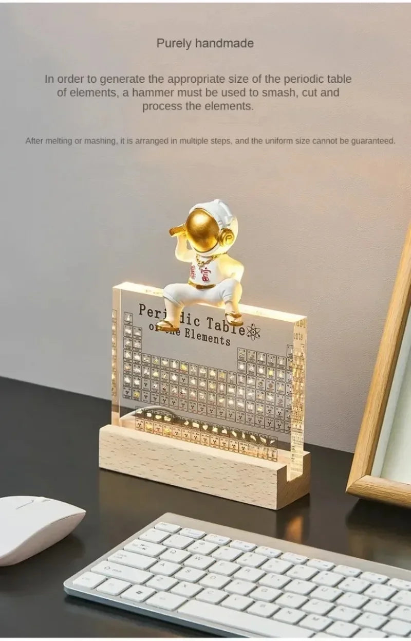 Decorative periodic table desk lamp on a desk with keyboard and mouse.