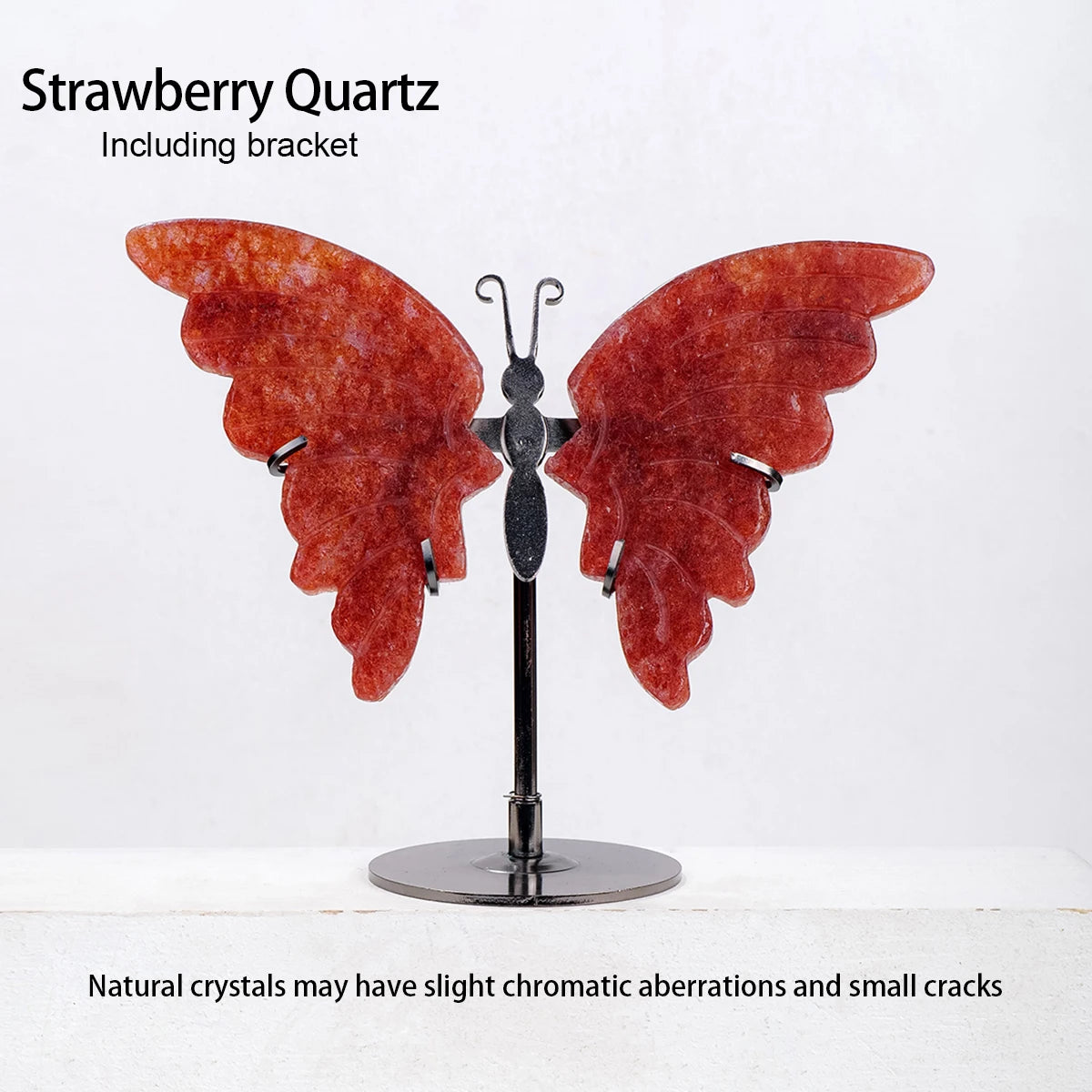 Butterfly sculpture made of strawberry quartz on a stand with text about natural crystals.
