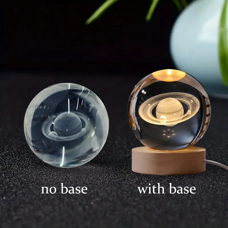 Two glass sphere lights, one without a base and one with a base, on a dark surface.