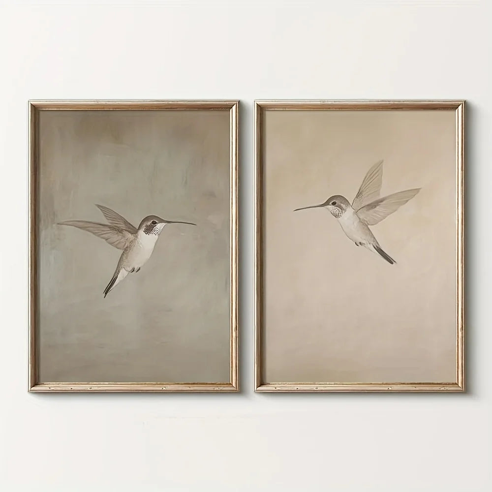 Two framed prints of hummingbirds on a white background